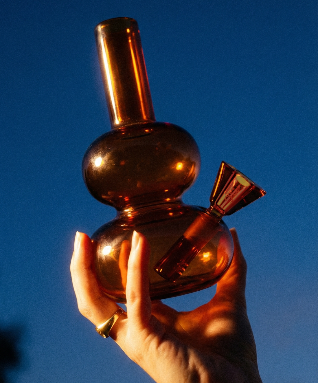 loke glass lilah in amber held in hand

