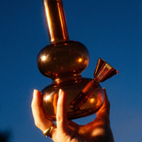 loke glass lilah in amber held in hand

